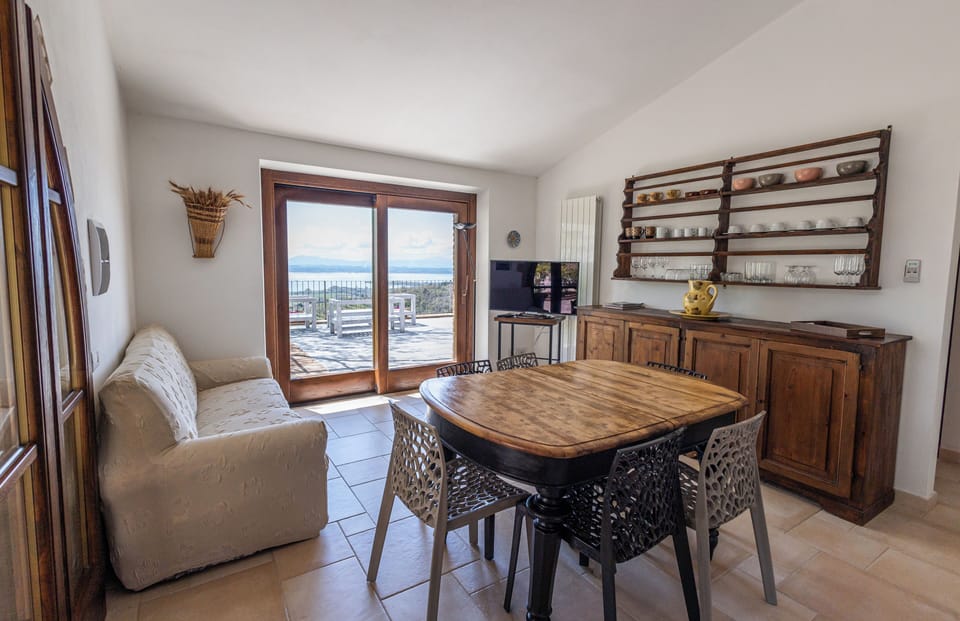 Villa, 2 Queen Beds, Lake View | Living area | 32-inch Smart TV with cable channels