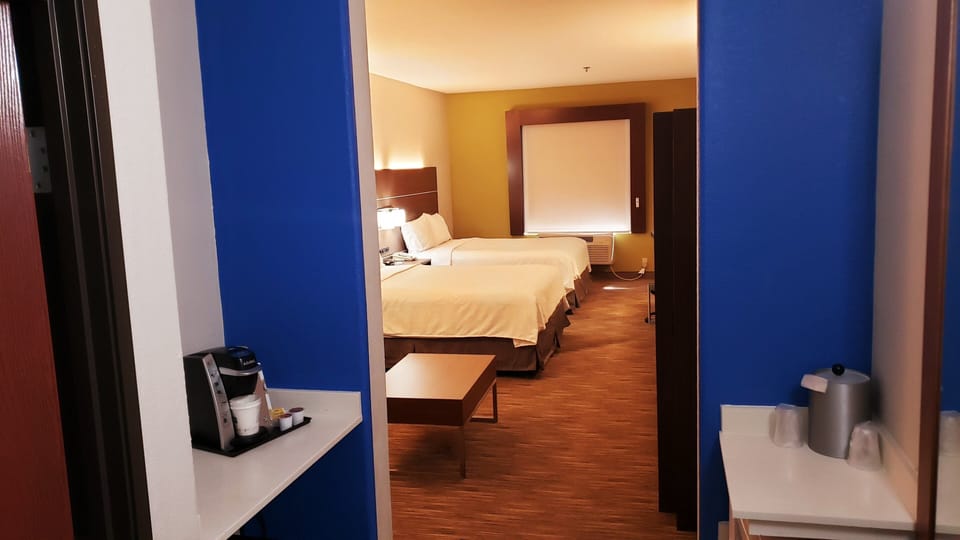 In-room safe, desk, iron/ironing board, cribs (free)