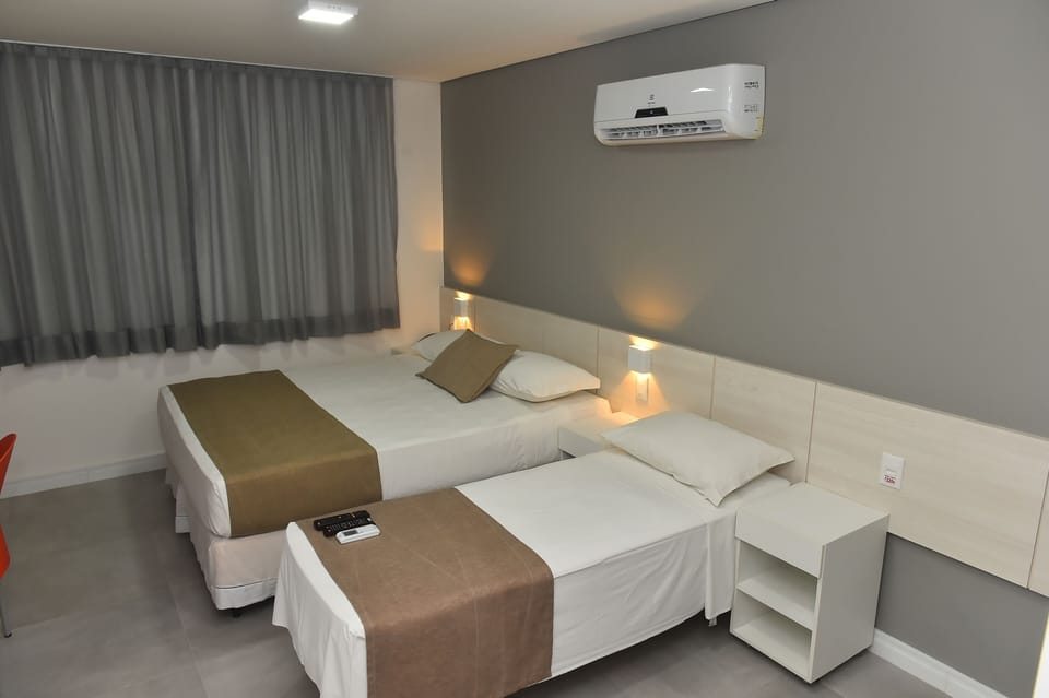 Family Triple Room | Minibar, in-room safe, free WiFi, bed sheets