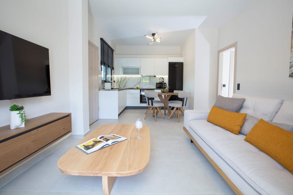 Junior Suite, Private Pool | Living area | 50-inch LED TV with premium channels