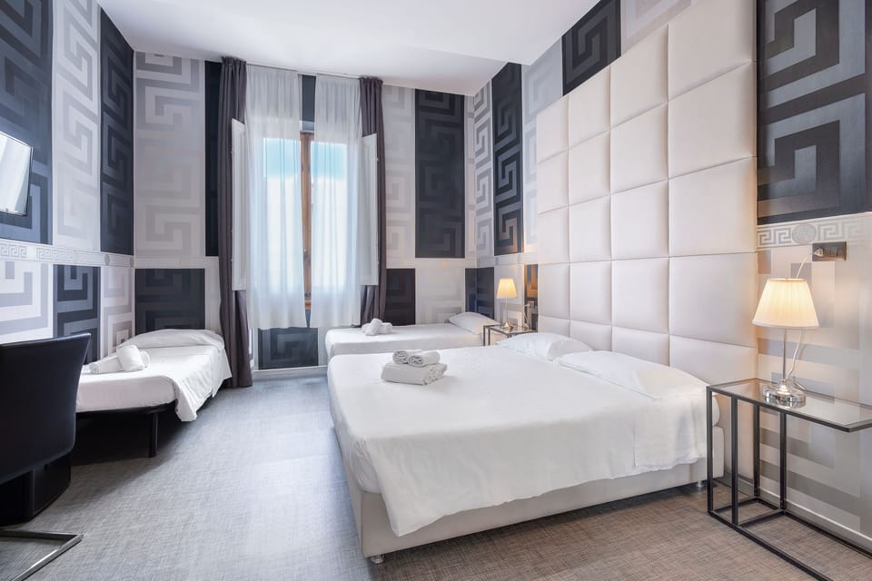 Quadruple Room | Down comforters, minibar, in-room safe, desk