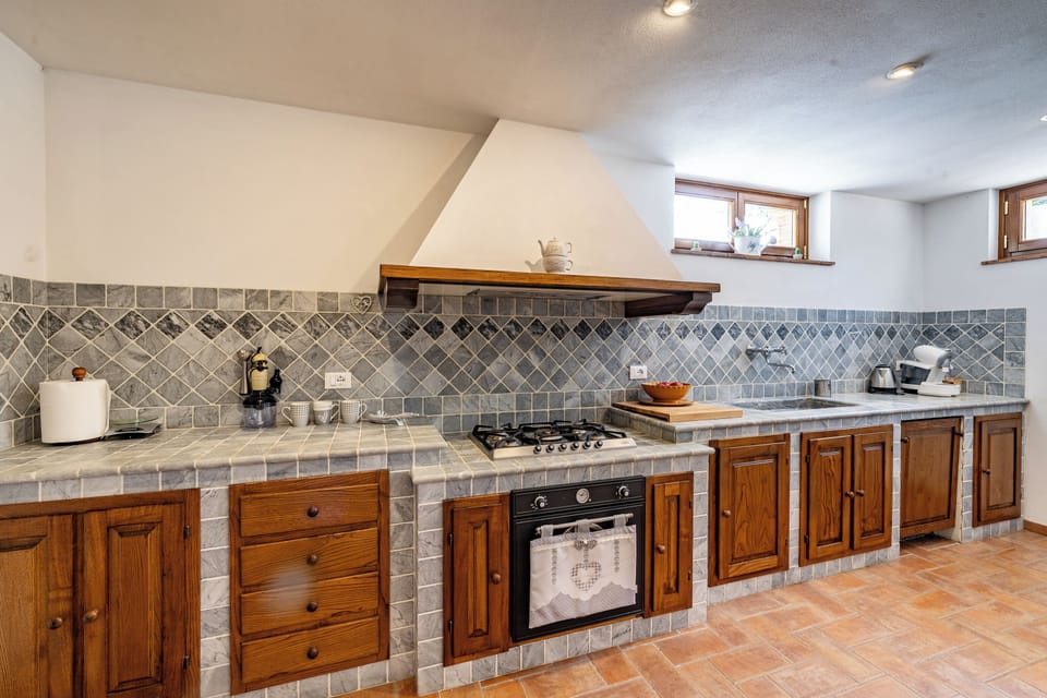 Family Villa, Multiple Bedrooms, Mountainside (Villa Vittoriano - Surrounded By) | Private kitchen | Fridge, microwave, oven, stovetop