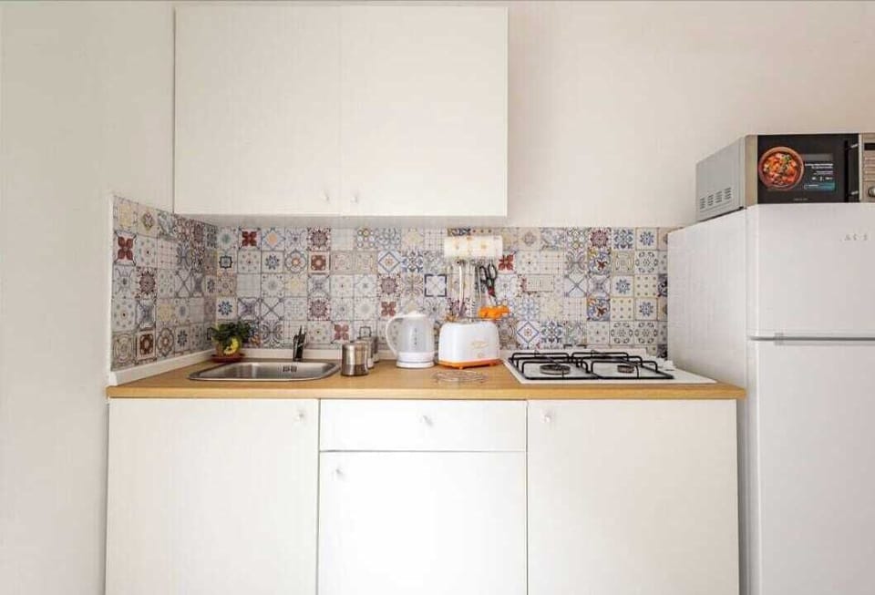 Family Apartment | Private kitchen | Electric kettle, highchair
