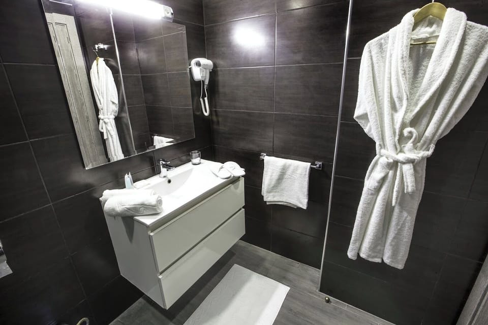 Shower, free toiletries, hair dryer, bathrobes