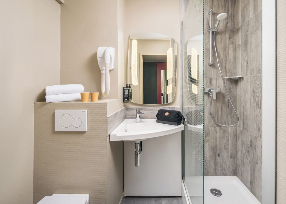 Shower, eco-friendly toiletries, hair dryer, towels