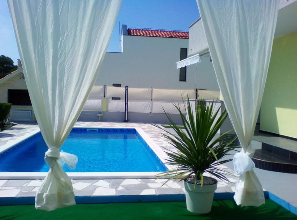 Villa (Villa Ava) | Pool | Seasonal outdoor pool, pool umbrellas, sun loungers