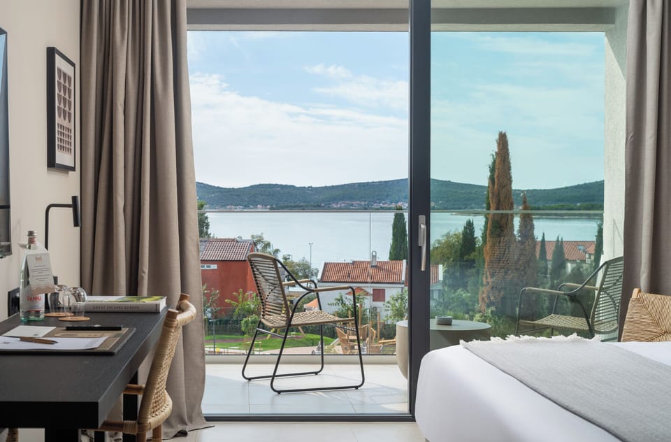 Deluxe Double Room, Balcony, Sea View | In-room safe, desk, blackout drapes, iron/ironing board