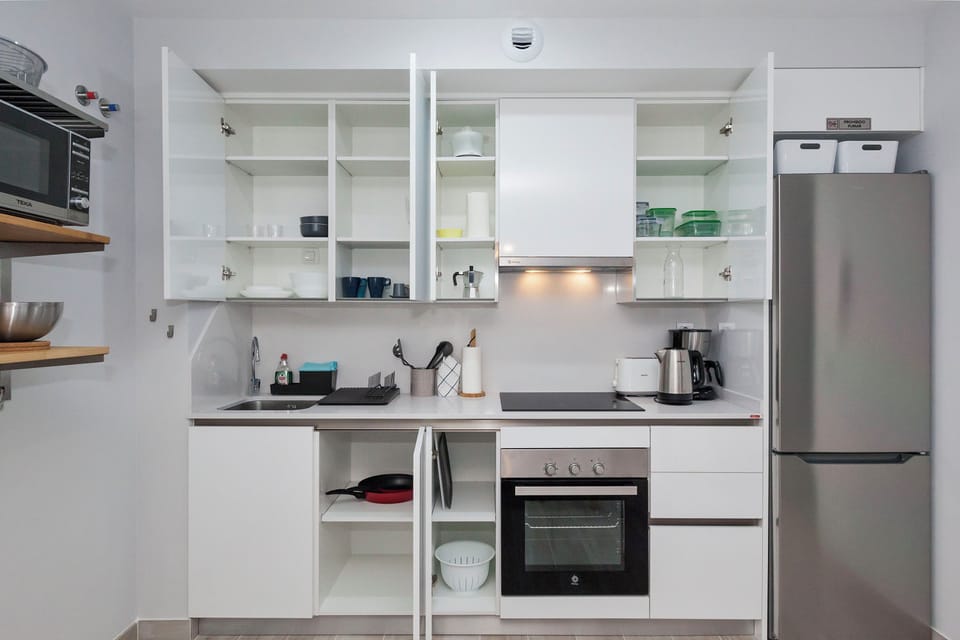 Comfort Apartment | Private kitchen | Full-size fridge, microwave, oven, stovetop