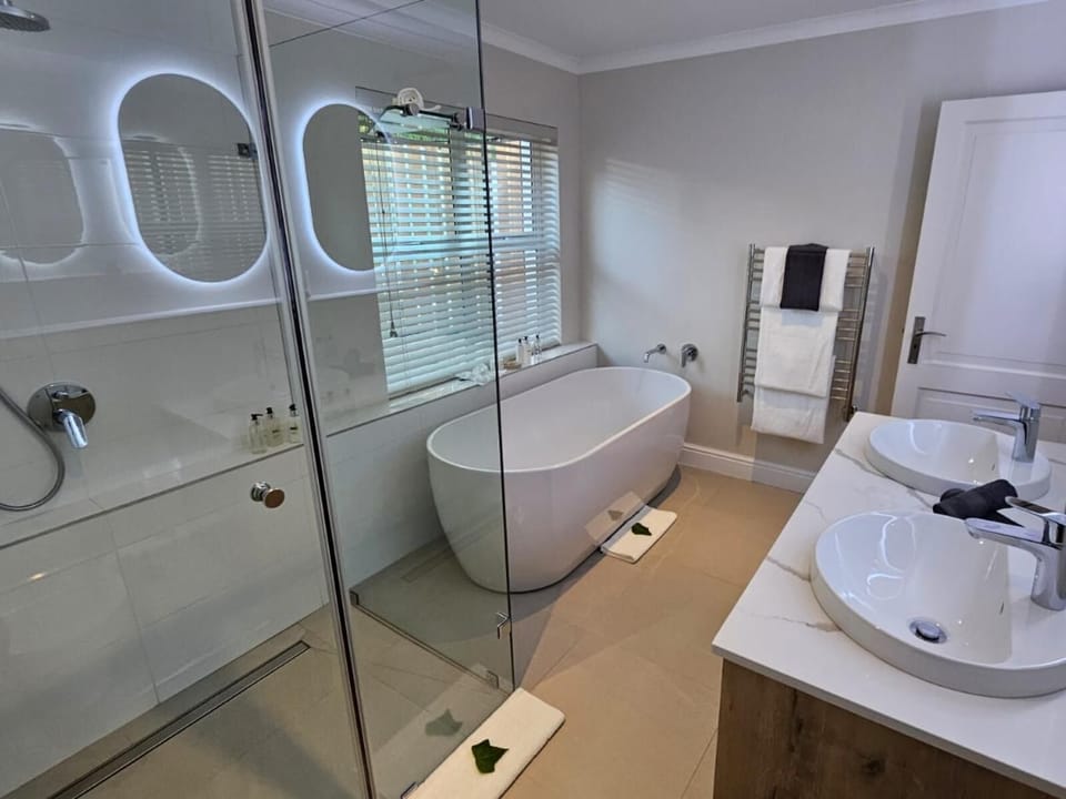 Separate tub and shower, deep soaking tub, designer toiletries