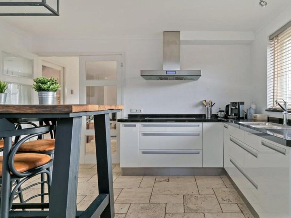 Villa | Private kitchen | Fridge, electric kettle, highchair