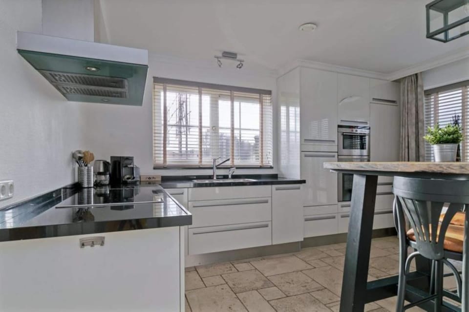 Villa | Private kitchen | Fridge, electric kettle, highchair