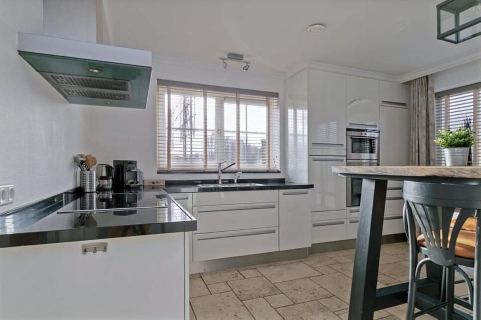 Villa | Private kitchen | Fridge, electric kettle, highchair
