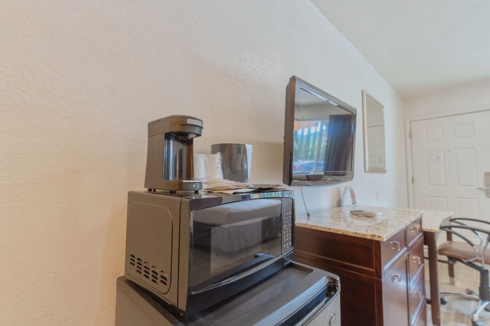 Premium bedding, desk, laptop workspace, blackout drapes