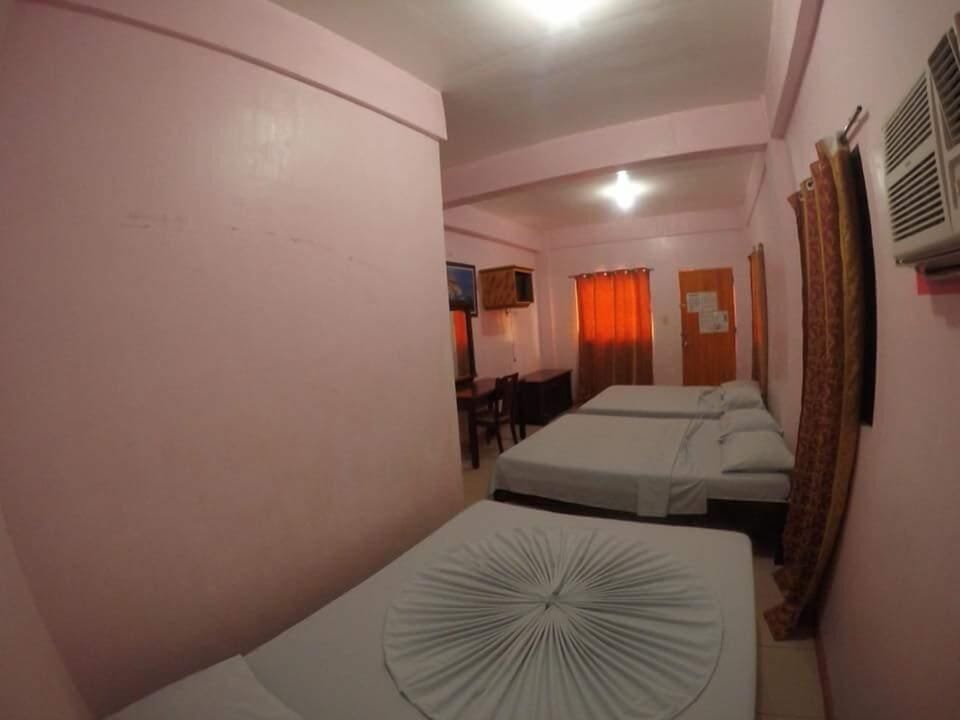 Economy Room, Multiple Beds, Balcony, Partial Sea View | Premium bedding, individually decorated, individually furnished, desk
