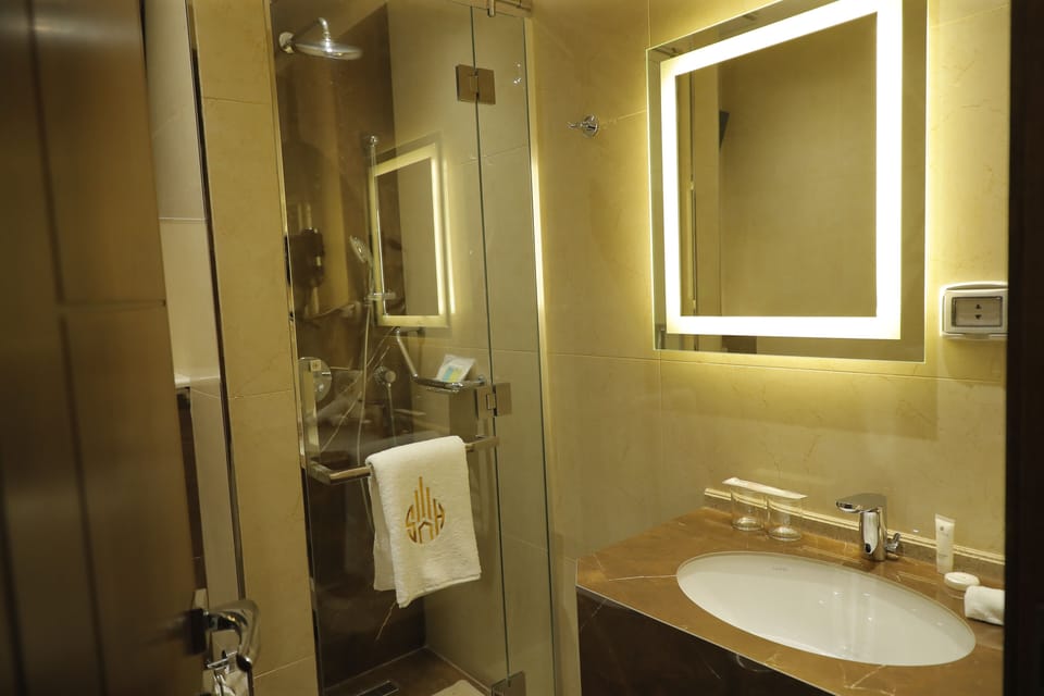 Rainfall showerhead, designer toiletries, hair dryer, bathrobes