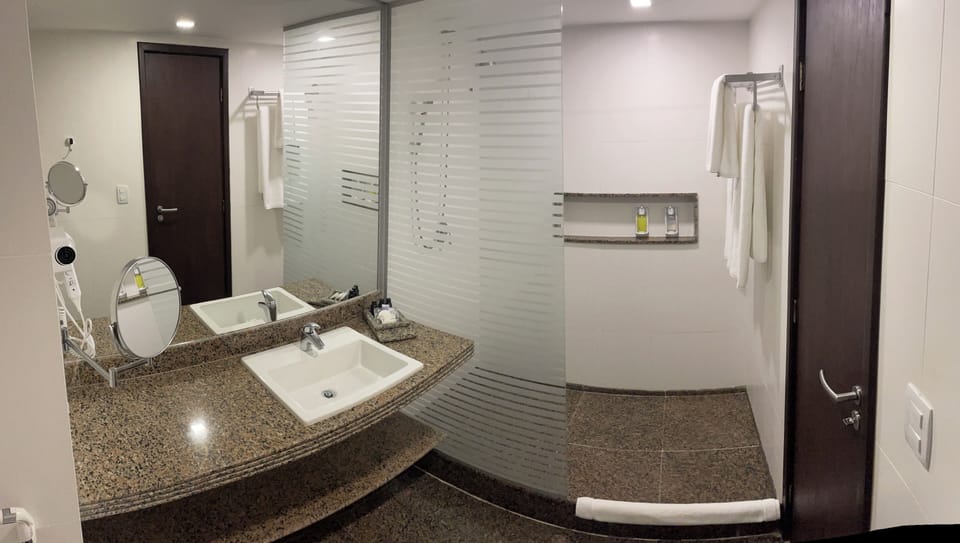 Deluxe Quadruple Room, Pool View | Bathroom | Hair dryer