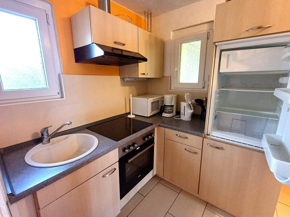 Apartment | Private kitchen | Electric kettle, highchair