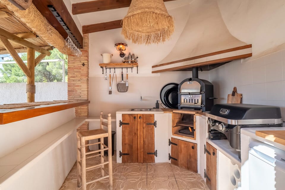 Villa | Private kitchen | Fridge, highchair