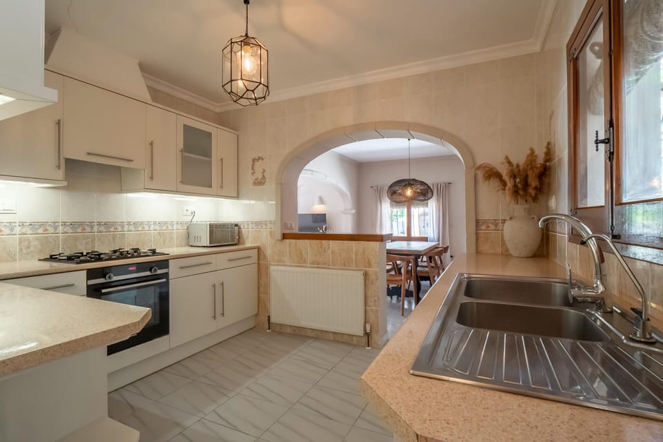 Villa | Private kitchen | Fridge, highchair