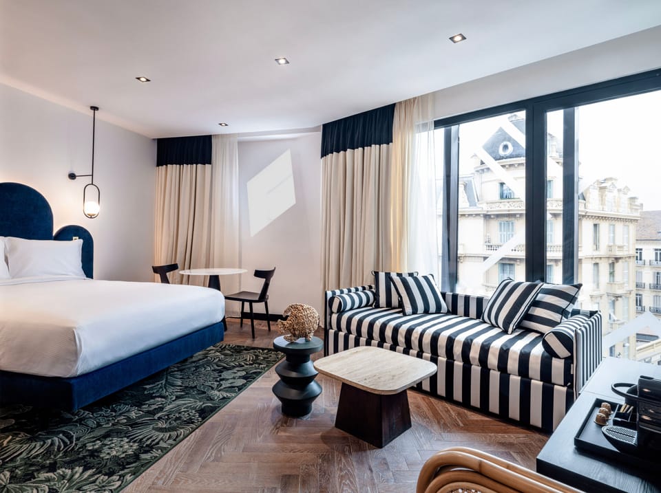 Deluxe Room, 1 Queen Bed | Minibar, in-room safe, desk, laptop workspace