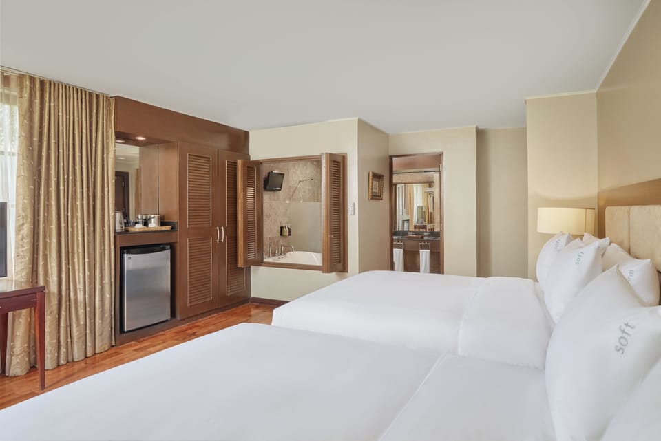 Suite, 2 Queen Beds, Jetted Tub | Hypo-allergenic bedding, in-room safe, desk, laptop workspace