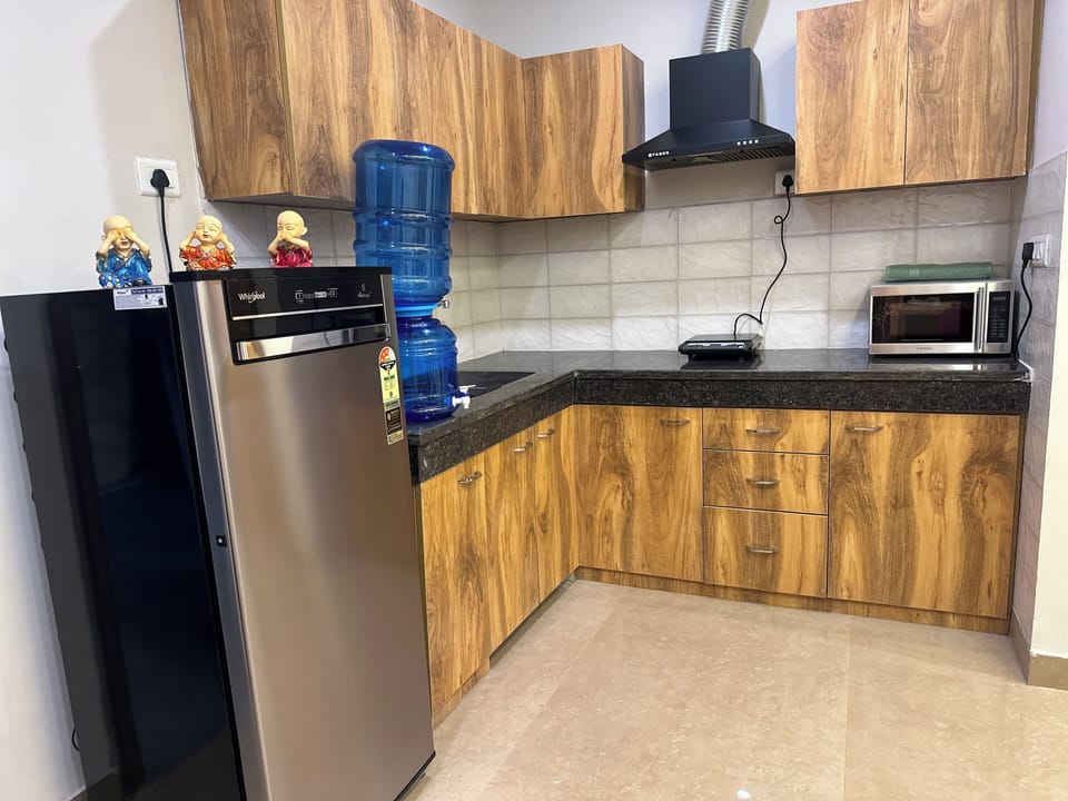 Luxury Apartment | Private kitchen | Fridge, microwave, electric kettle, toaster