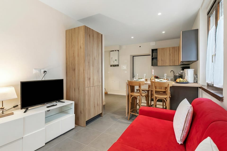 Standard Apartment, 1 Bedroom, Microwave (Appartamento 30 NODI Torbole) | Living area | Flat-screen TV