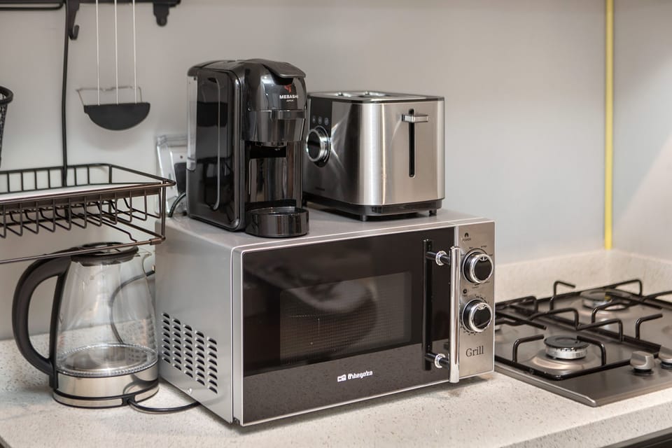 Premium Apartment, 1 Bedroom, Balcony, Canal View | Private kitchen | Full-size fridge, microwave, oven, stovetop