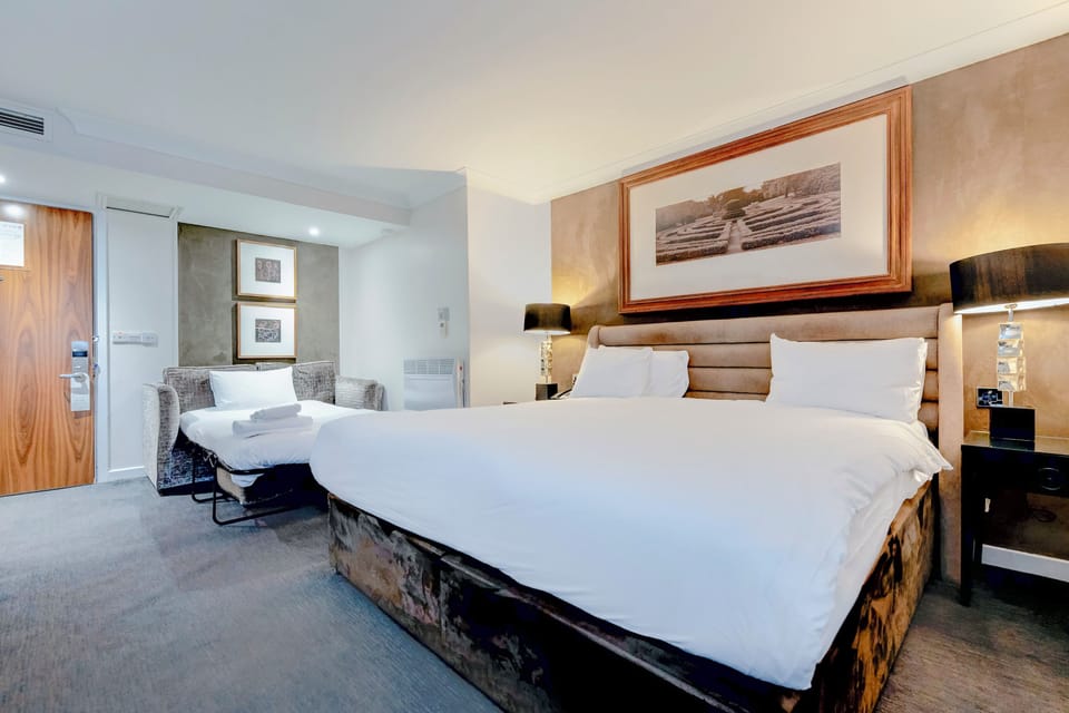 Deluxe Family studio | In-room safe, desk, laptop workspace, blackout drapes