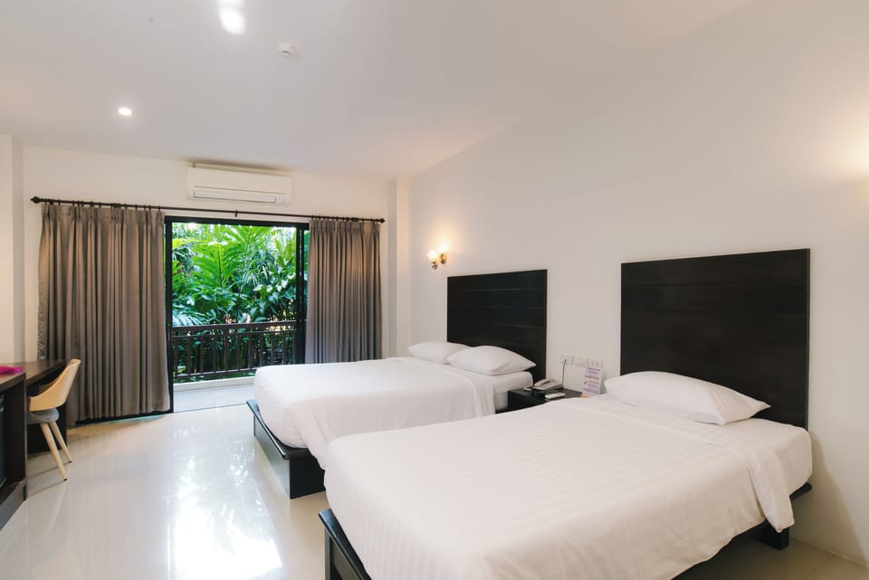 Family Room, Balcony | Blackout drapes, free WiFi, bed sheets