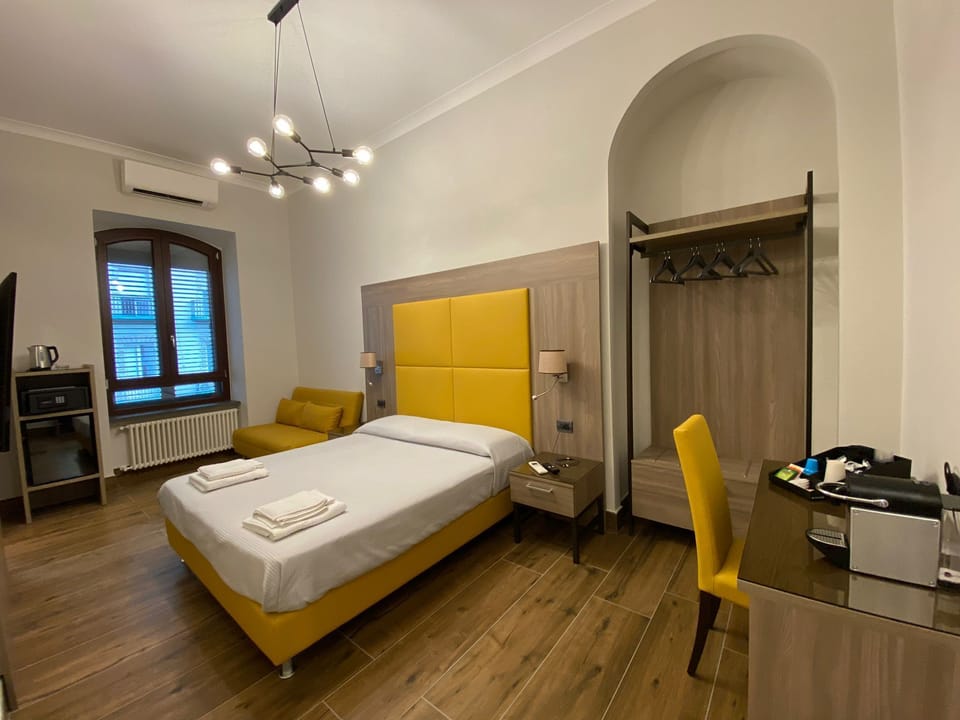 Quadruple Room CARONTE | Premium bedding, down comforters, minibar, in-room safe