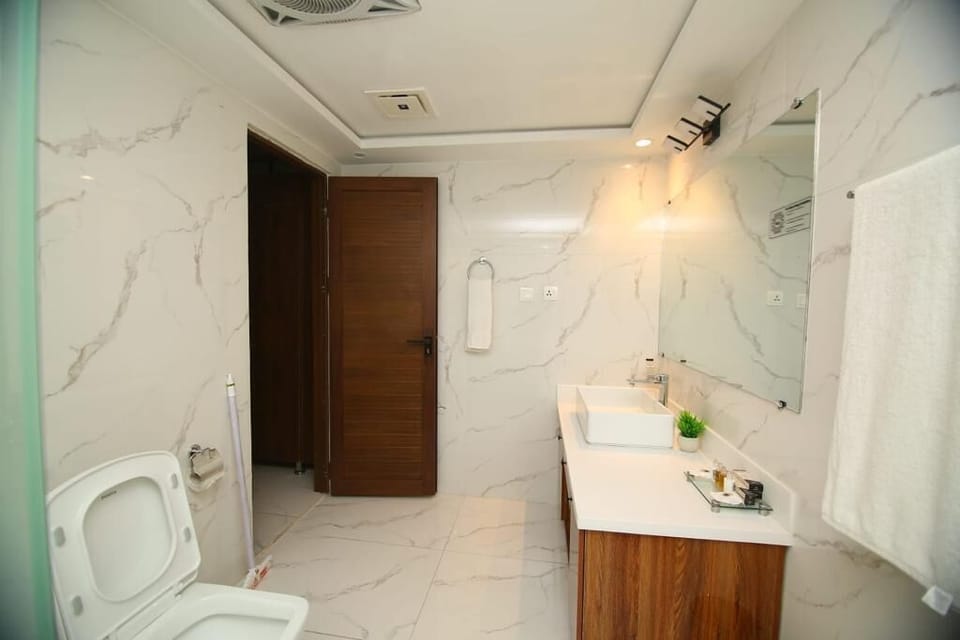 Shower, hair dryer, slippers, towels