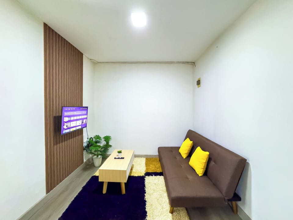 Standard Apartment | Living area | 43-inch Smart TV with cable channels, Netflix, streaming services