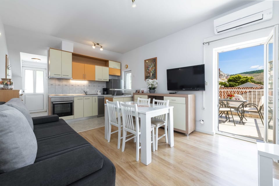 Apartment (One Bedroom Apartment with Balcony an) | Living room | 32-inch flat-screen TV with cable channels