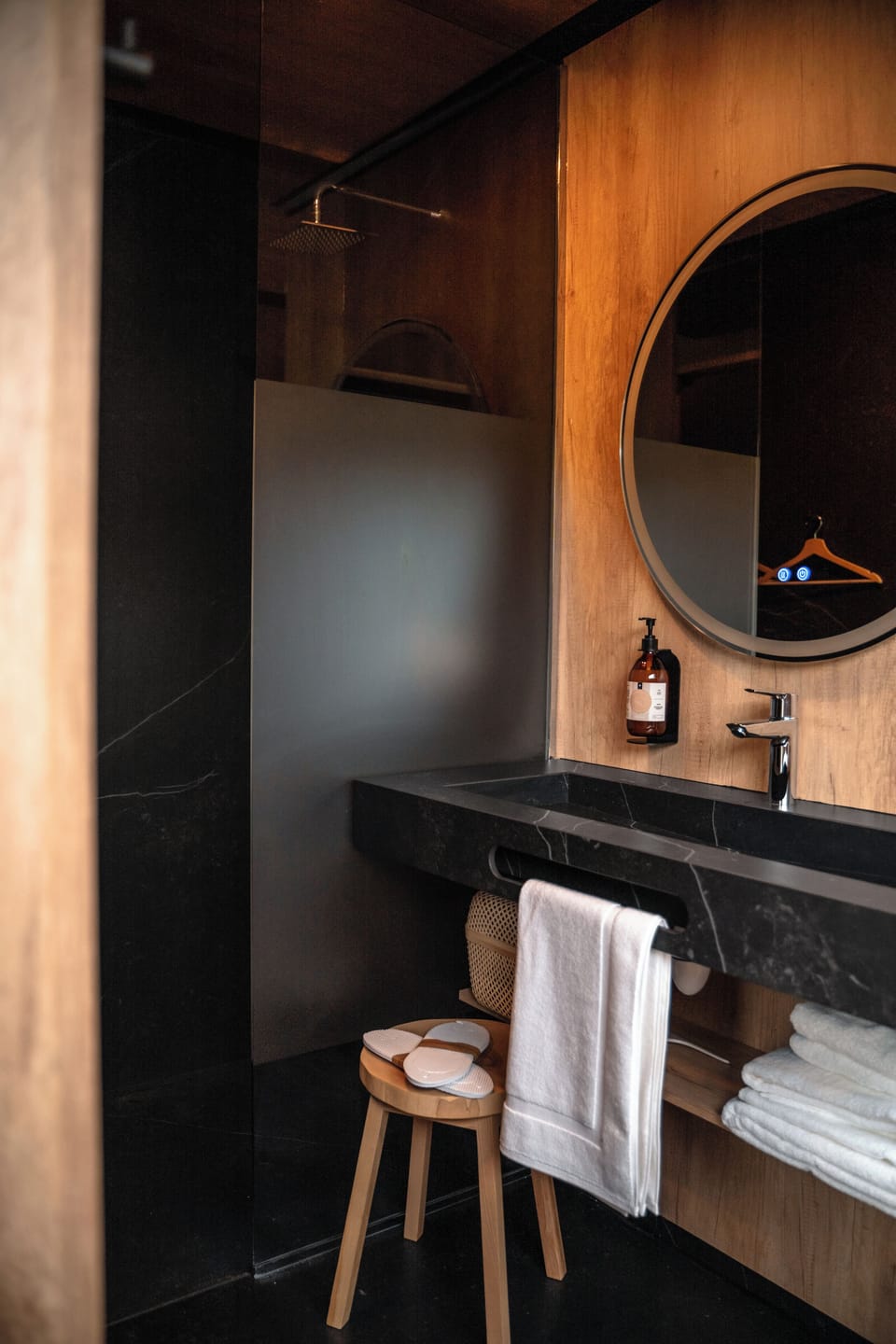 Shower, hair dryer, slippers, towels