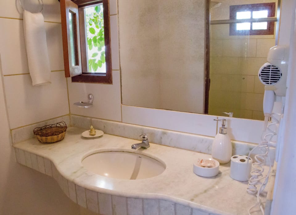 Classic Chalet, Lanai, Garden View | Bathroom | Hair dryer, towels, soap, shampoo