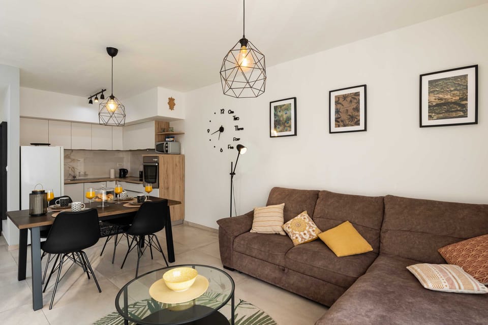 Apartment (Two Bedroom Apartment with Balcony) | Living room | 32-inch flat-screen TV with digital channels