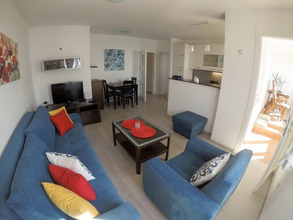Apartment (One Bedroom Apartment with Sea View a) | Living room | 32-inch flat-screen TV with satellite channels