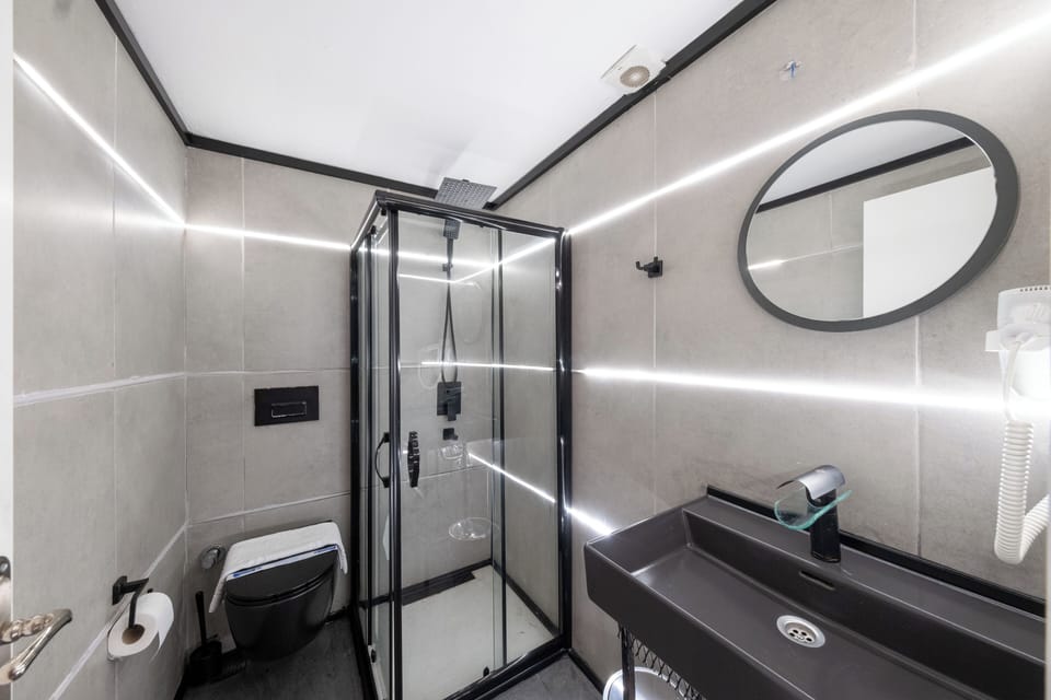 Shower, eco-friendly toiletries, hair dryer, slippers