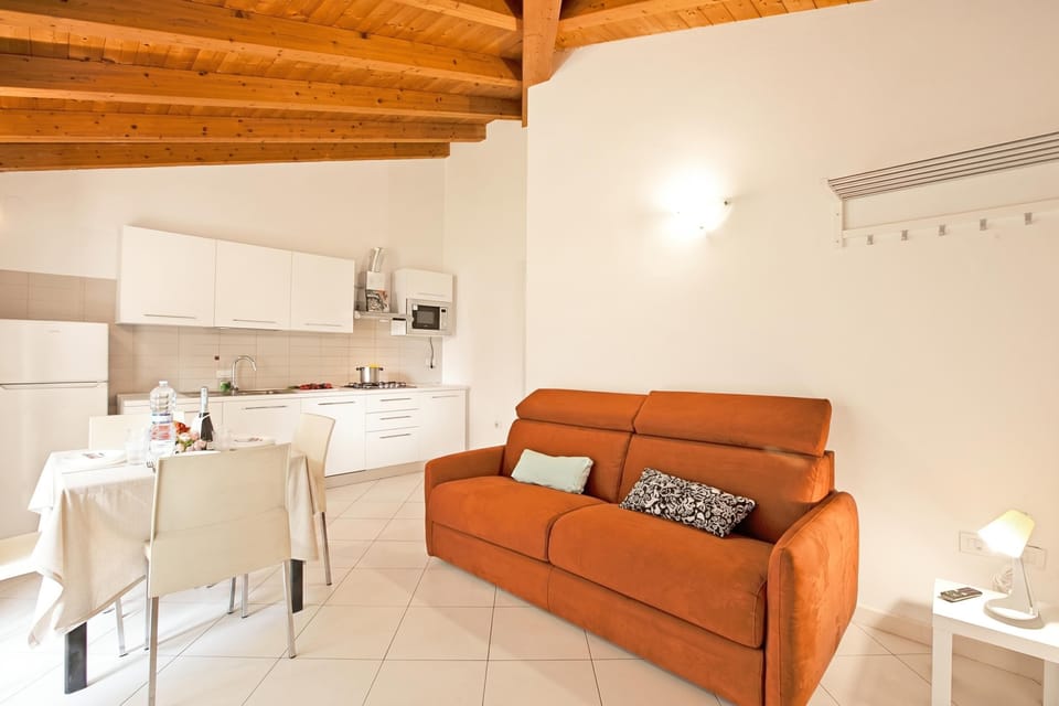 Family House, Multiple Bedrooms (Sara’s Garden Home) | Living area | 21-inch flat-screen TV with cable channels, TV