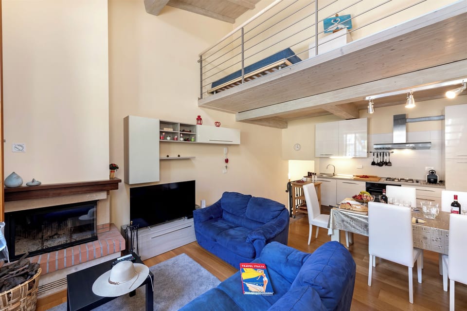 Family Townhome, 2 Bedrooms, Fireplace (Trekking Home La Via degli Dei) | Living area | Flat-screen TV