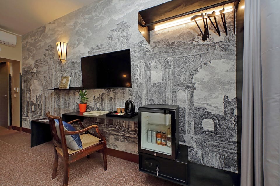 Deluxe Triple Room, City View | Minibar (some free items), in-room safe, desk, laptop workspace