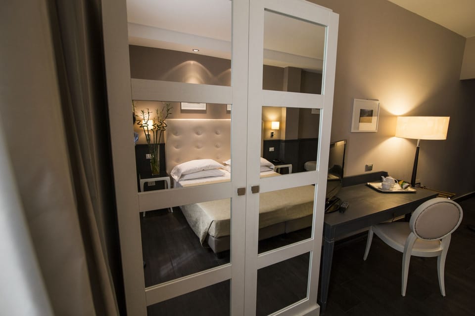 Superior Triple Room | Minibar, in-room safe, desk, soundproofing