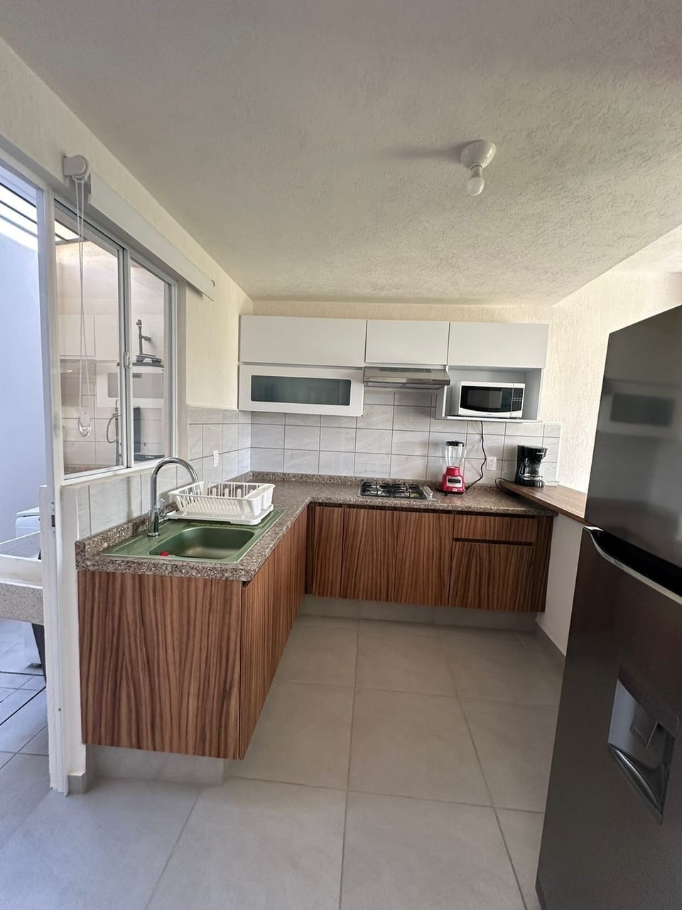Basic Townhome | Private kitchen | Fridge, microwave, dishwasher, blender