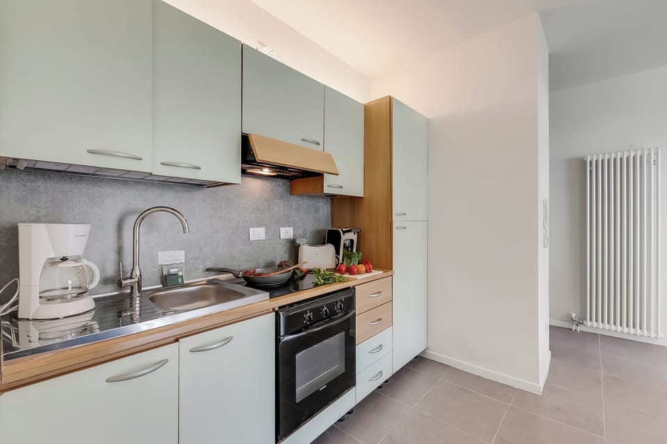 Family Apartment, 1 Bedroom, Balcony, Lakeside (Appartamento 30 Nodi 2 Torbole-Arco) | Private kitchen | Fridge, microwave, stovetop, coffee/tea maker