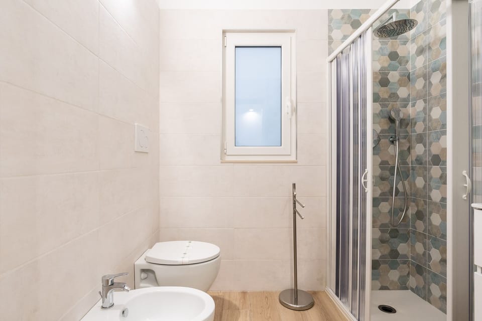 Basic Double Room, 1 Queen Bed, Private Bathroom | Bathroom | Shower, hair dryer, towels, soap