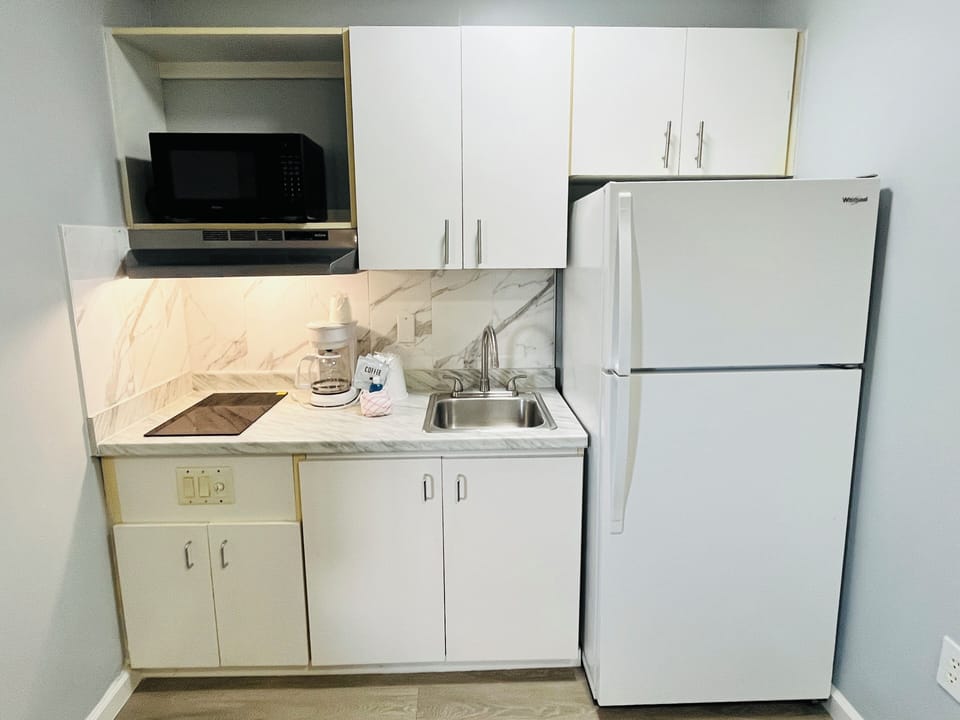 Mini-fridge, microwave, stovetop, coffee/tea maker