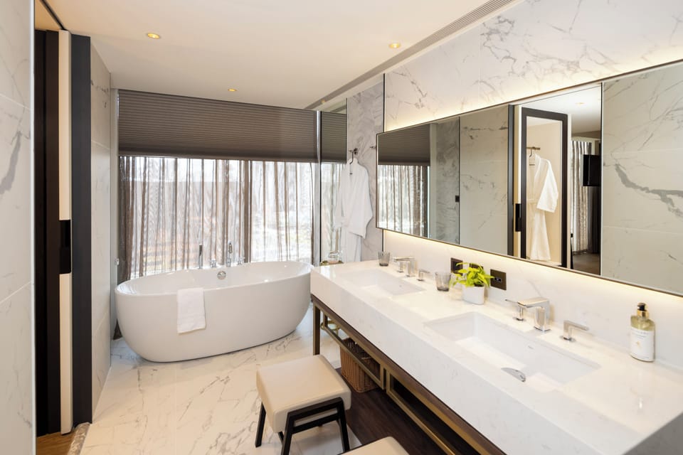 Luxury Suite | Bathroom | Designer toiletries, hair dryer, bathrobes, towels