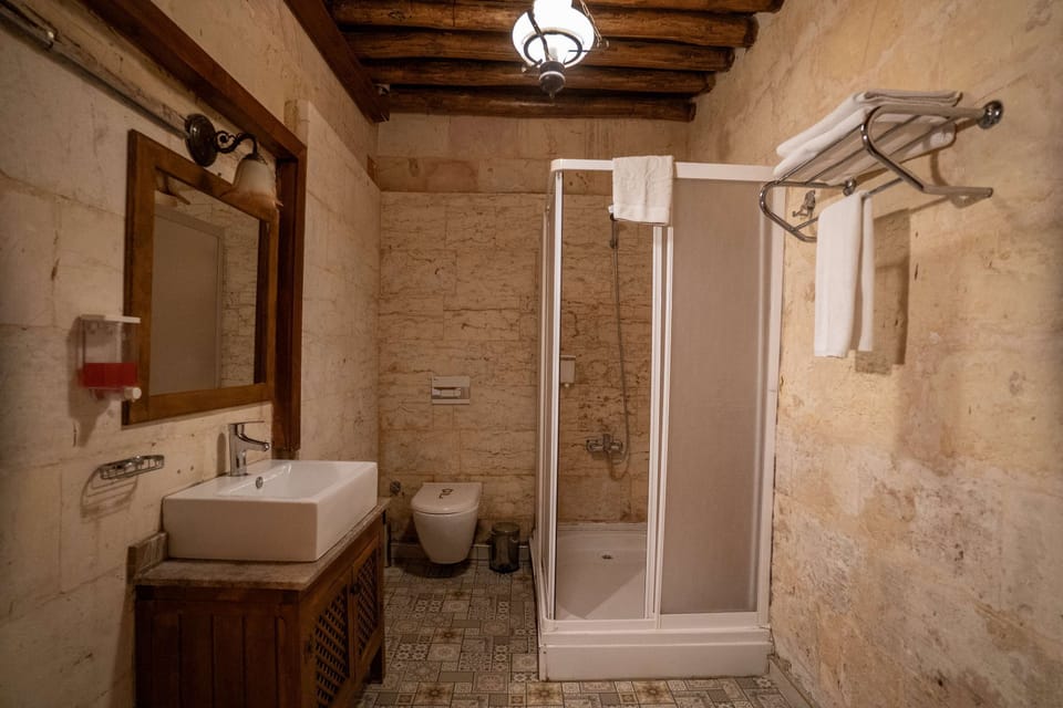Standard Triple Room, Courtyard View | Bathroom | Shower, hair dryer, towels, soap