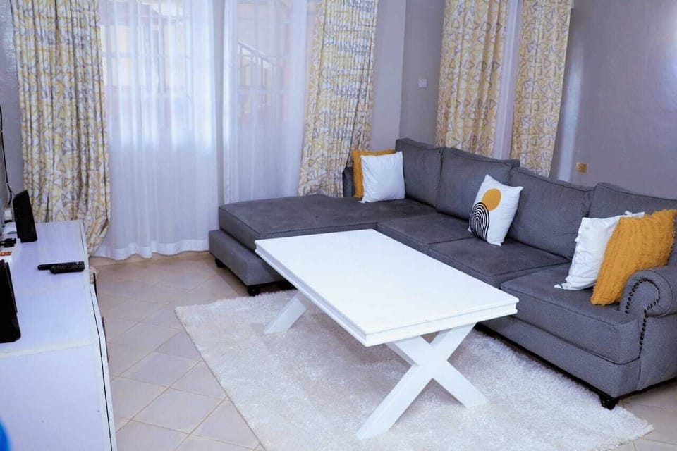 Deluxe Apartment, City View | Living area | 64-inch Smart TV with digital channels